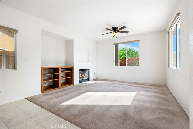 living room featuring ceiling fan and light carpet