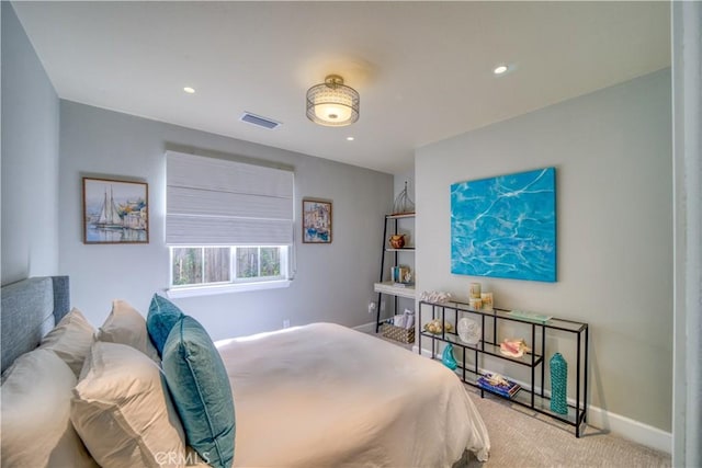 bedroom featuring light carpet