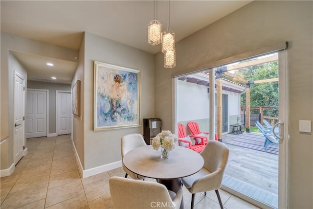 dining area featuring light tile patterned floors