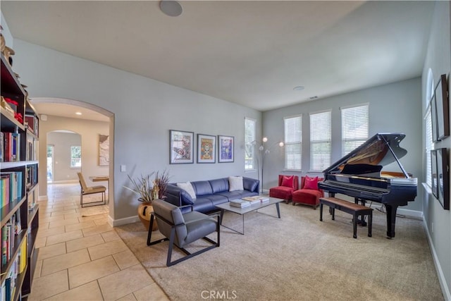 tiled living room with a healthy amount of sunlight