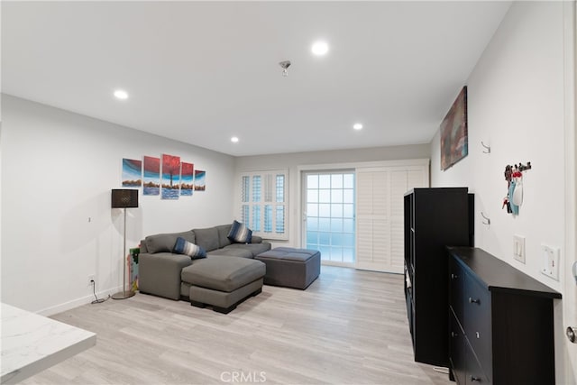 living room with light hardwood / wood-style floors