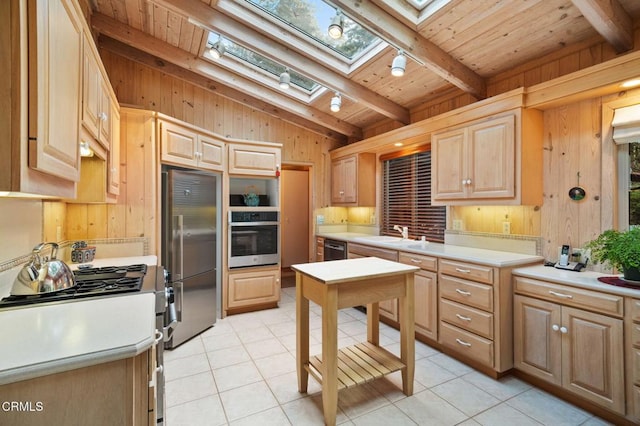 kitchen featuring wood walls, wooden ceiling, stainless steel appliances, and light tile patterned floors