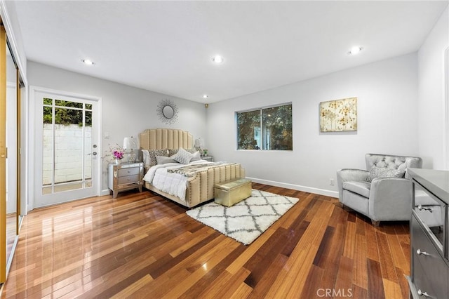 bedroom with hardwood / wood-style floors