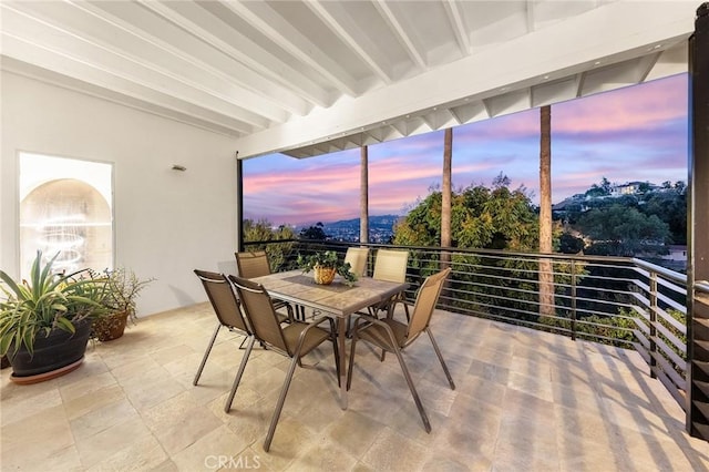 sunroom featuring beamed ceiling