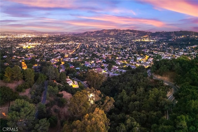 aerial view at dusk with a mountain view