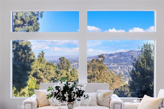 sunroom / solarium featuring a mountain view