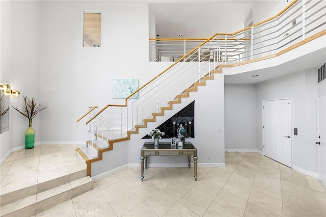 stairway with a towering ceiling