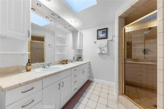 bathroom with tile patterned floors, a skylight, and an enclosed shower