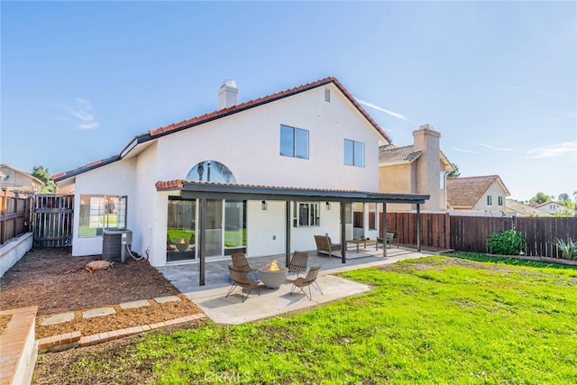 rear view of house featuring a patio area, an outdoor living space, a yard, and cooling unit