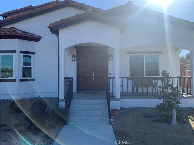 entrance to property with a porch