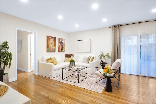 living room with light hardwood / wood-style flooring