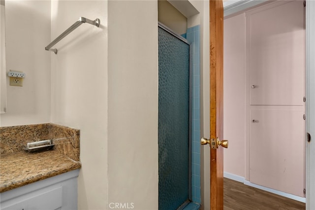 8653 Norwood Pl, Rosemead, CA 91770 - bathroom featuring a stall shower and wood finished floors