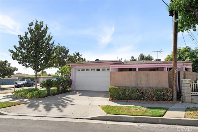 8653 Norwood Pl, Rosemead, CA 91770 - view of front facade with concrete driveway and a garage