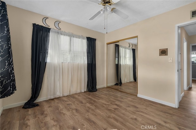8653 Norwood Pl, Rosemead, CA 91770 - spare room featuring healthy amount of natural light, wood finished floors, baseboards, and a ceiling fan
