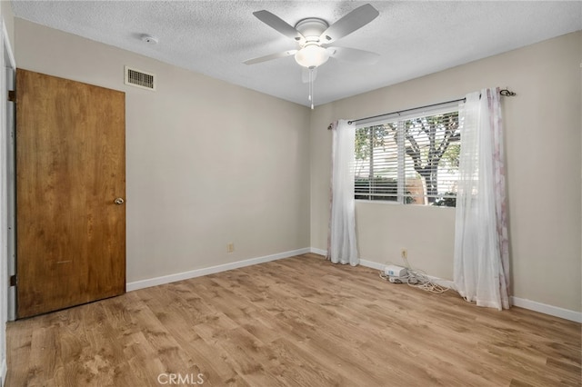 8653 Norwood Pl, Rosemead, CA 91770 - empty room featuring light wood finished floors, a ceiling fan, a textured ceiling, baseboards, and a smoke detector