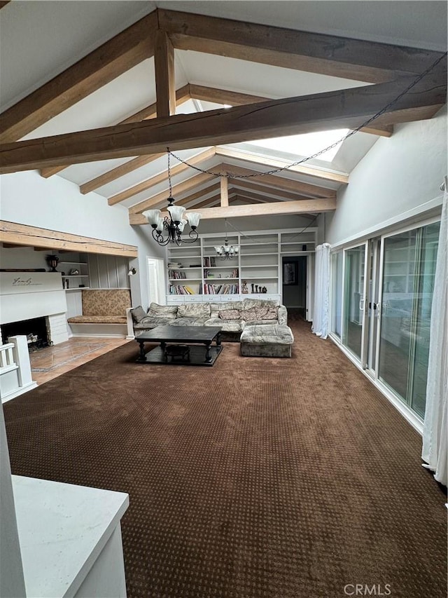 interior space with beam ceiling, carpet, and an inviting chandelier