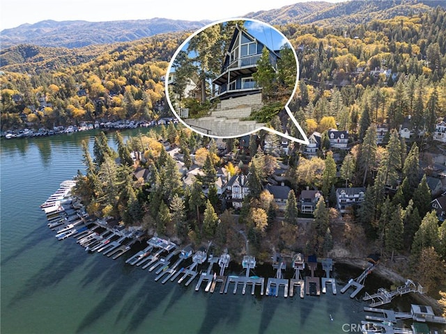 aerial view featuring a water and mountain view