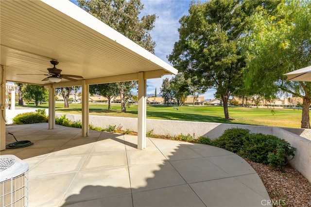 view of patio / terrace with ceiling fan and central AC