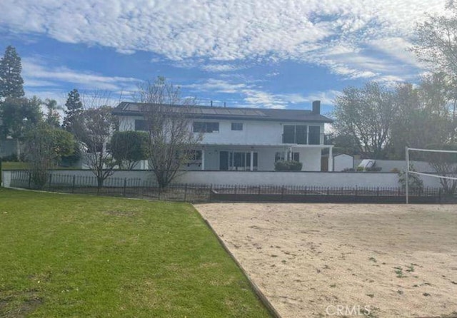 view of home's community featuring volleyball court and a yard