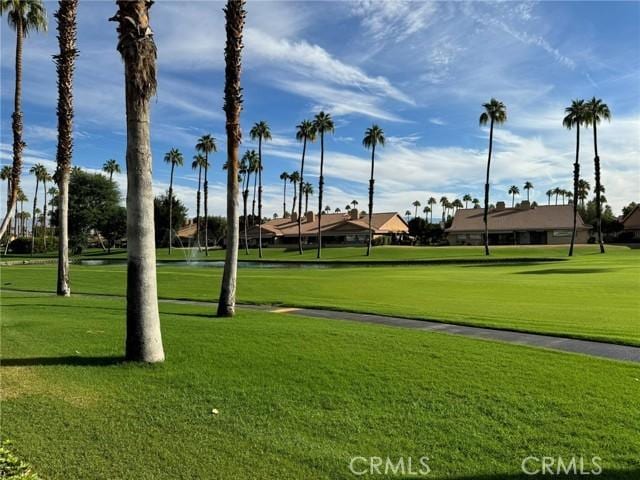 view of property's community featuring a yard