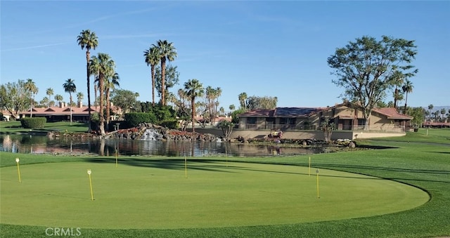 surrounding community featuring a water view