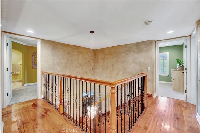 hall with hardwood / wood-style floors