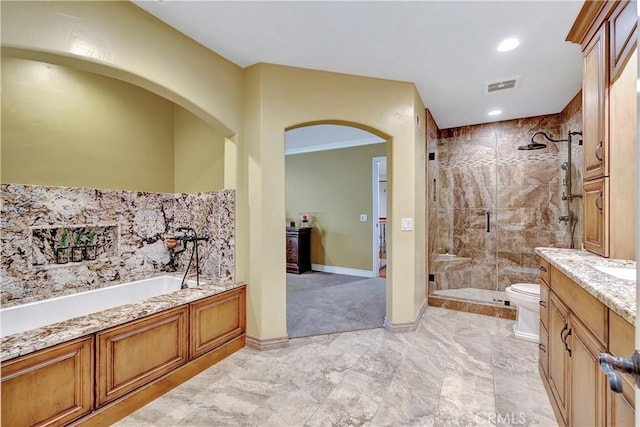 full bathroom featuring vanity, toilet, and independent shower and bath