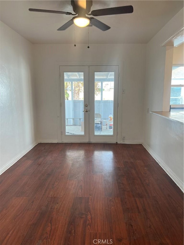 unfurnished room with french doors, dark hardwood / wood-style floors, and ceiling fan