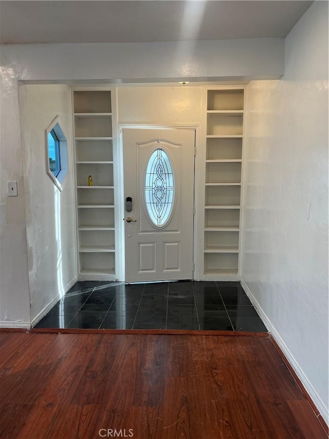 foyer with dark hardwood / wood-style flooring