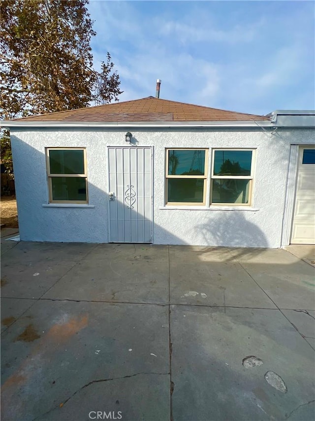 view of side of property featuring a patio