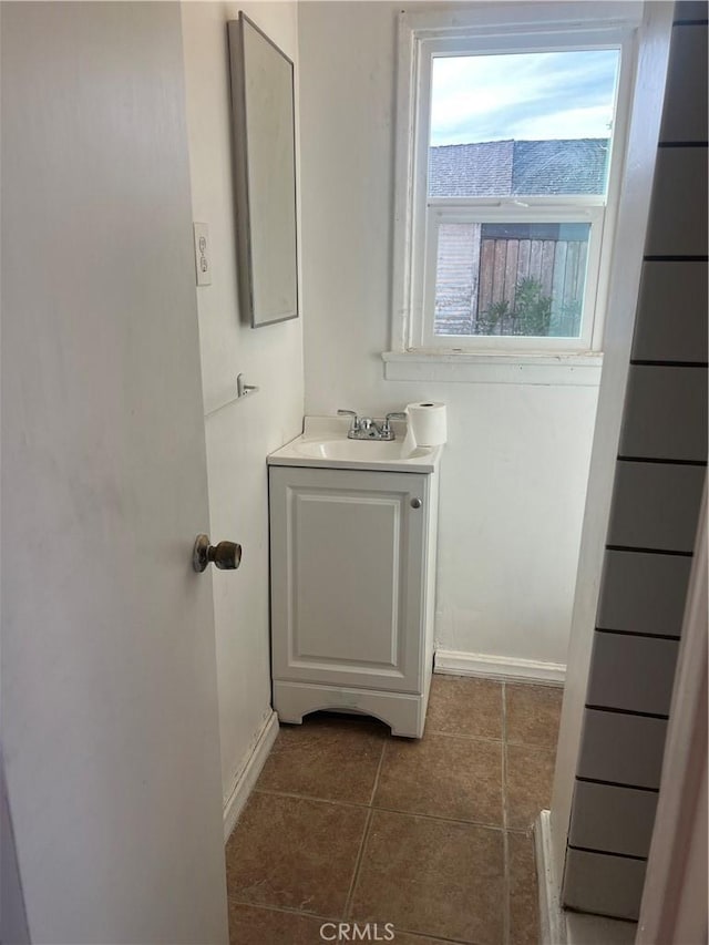 bathroom featuring tile patterned flooring and vanity