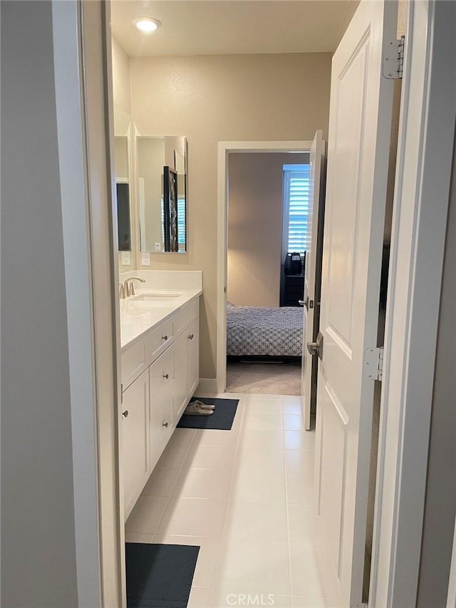 bathroom with tile patterned flooring and vanity