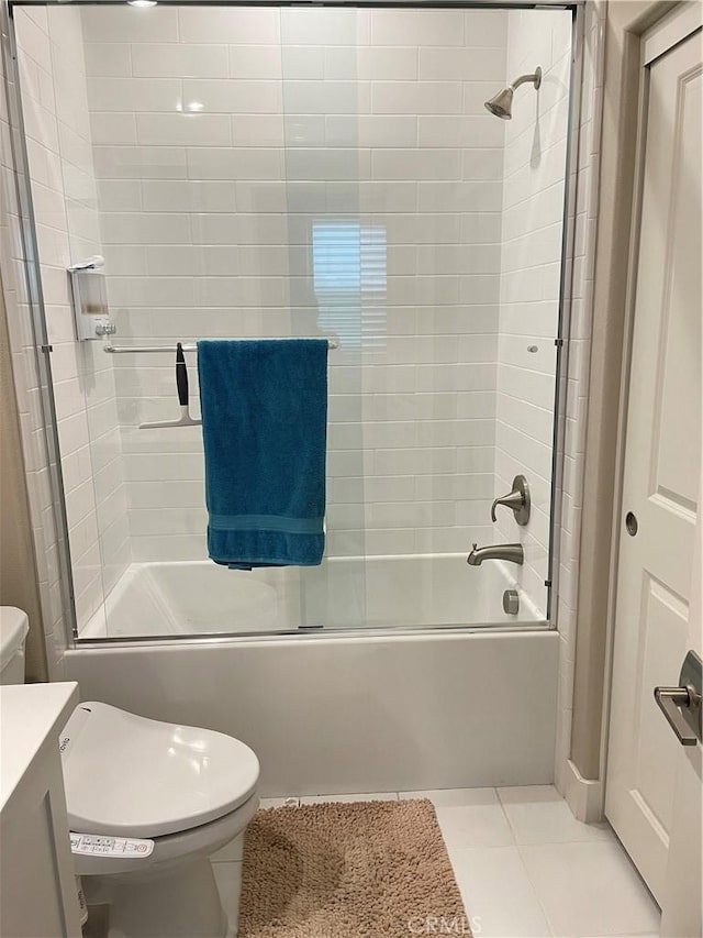 full bathroom with tile patterned flooring, vanity, toilet, and bath / shower combo with glass door