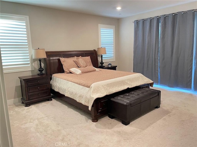 bedroom with light colored carpet