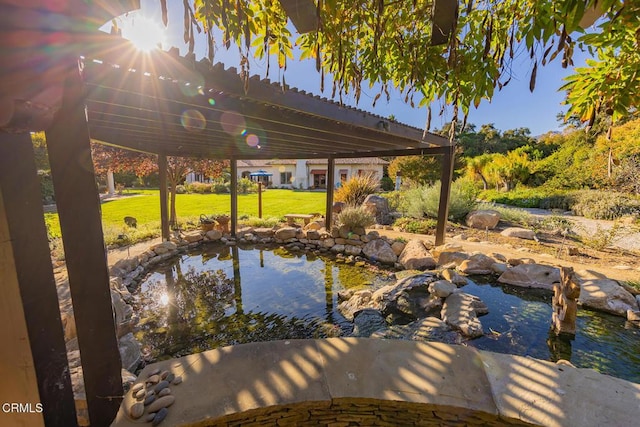 exterior space featuring a garden pond and a yard