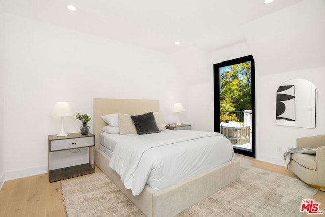 bedroom with light wood-type flooring