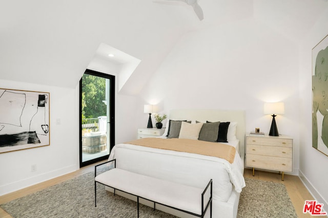 bedroom featuring access to exterior, light hardwood / wood-style flooring, ceiling fan, and lofted ceiling