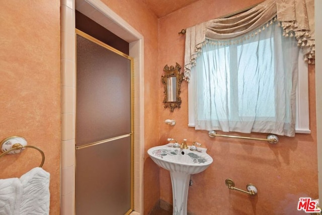 bathroom with an enclosed shower