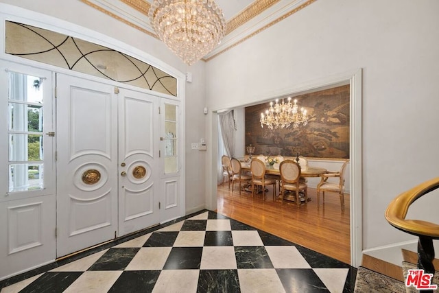 entrance foyer featuring dark hardwood / wood-style flooring and an inviting chandelier