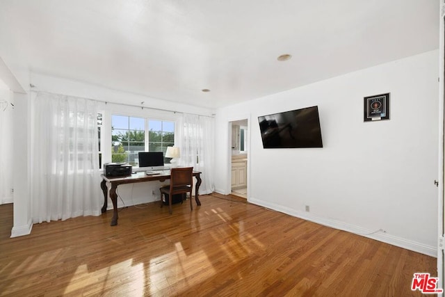 home office featuring hardwood / wood-style floors