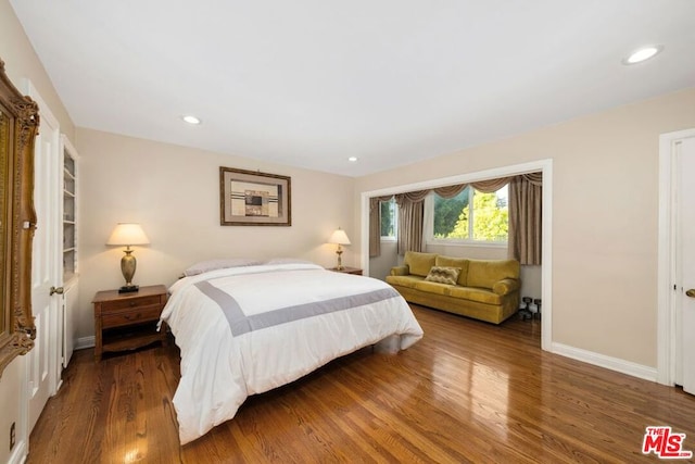 bedroom featuring dark hardwood / wood-style flooring