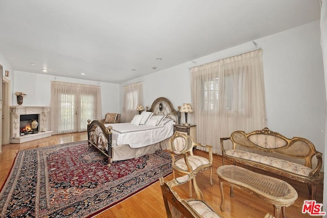 bedroom with light hardwood / wood-style flooring