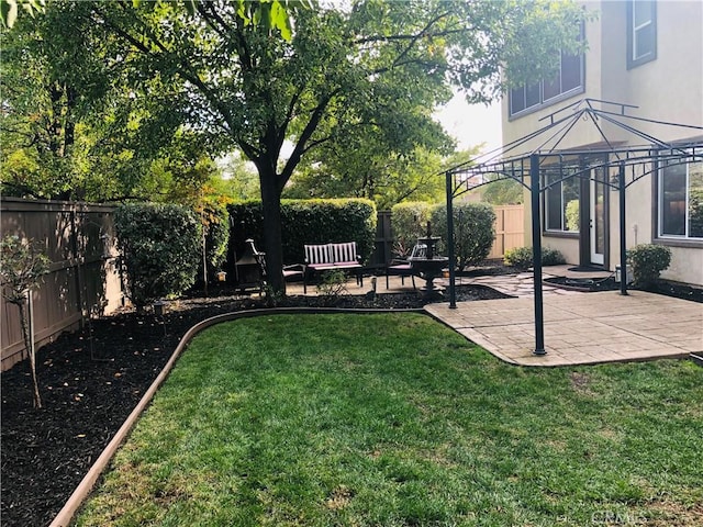 view of yard featuring a gazebo and a patio area