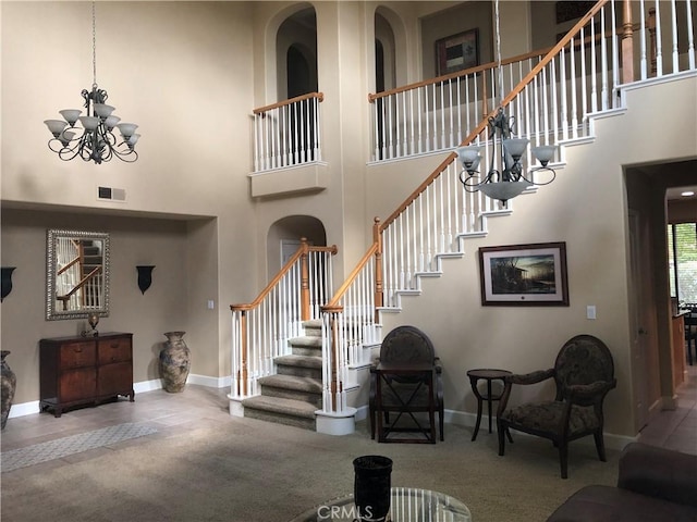 interior space with a chandelier and a high ceiling