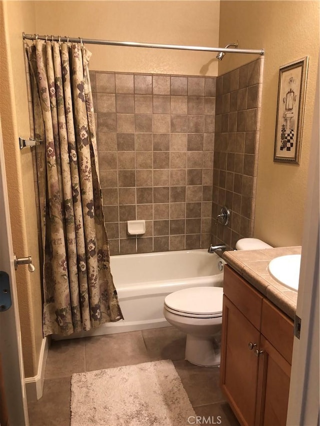 full bathroom featuring tile patterned flooring, vanity, toilet, and shower / tub combo with curtain