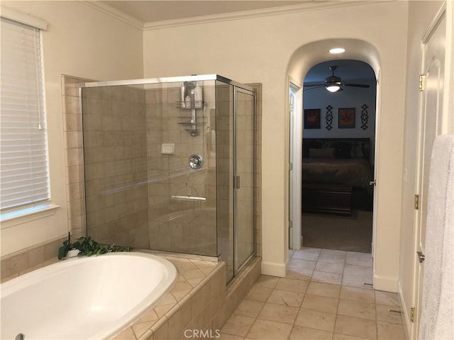 bathroom featuring tile patterned flooring, separate shower and tub, ceiling fan, and ornamental molding