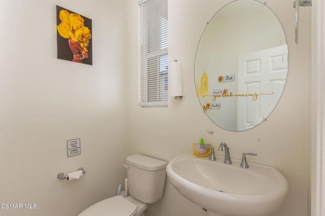 bathroom with toilet and sink