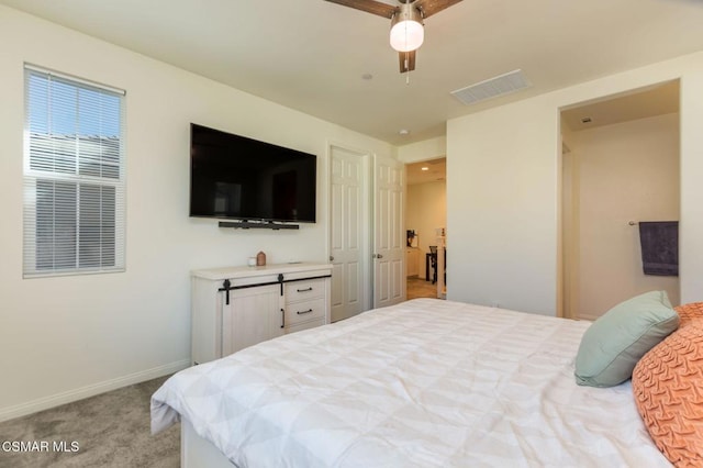 bedroom featuring ceiling fan and light carpet