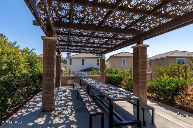 view of patio / terrace with a pergola and area for grilling