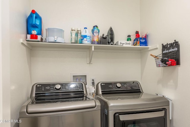 laundry room with washing machine and clothes dryer